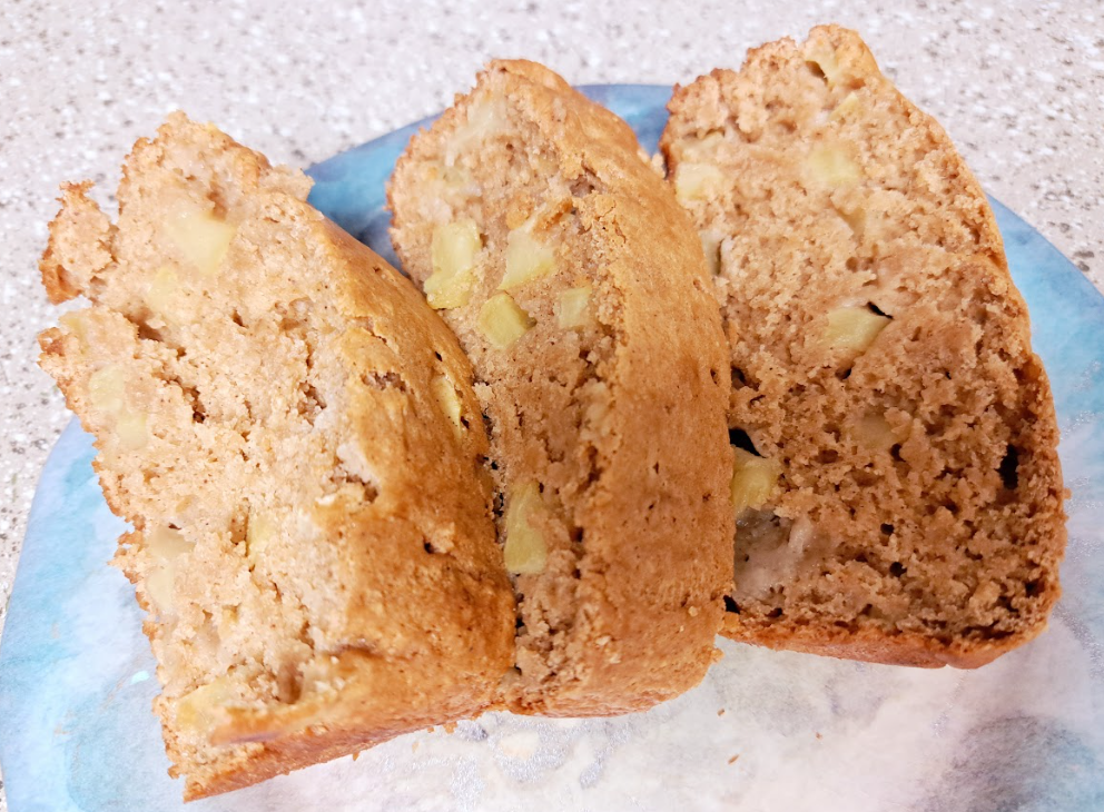 several chunky slices of apple spice loaf on a blue plate